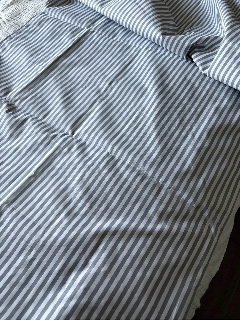 Grey and white striped tablecloth